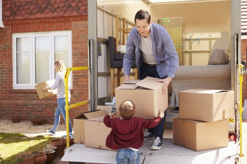 Removal team planning a home move in Pimlico with packed boxes and furniture