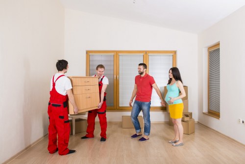 Careful packing of fragile household items by a local moving team in Pimlico