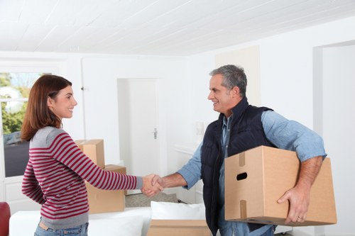 Professional movers carrying furniture during a Pimlico move